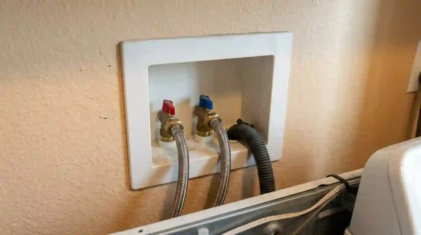 Recessed washer box with quarter turn valves and braided hoses in a Sacramento laundry room