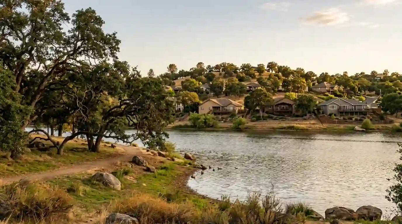 Foothill homes and oak trees around Cameron Park Lake in California