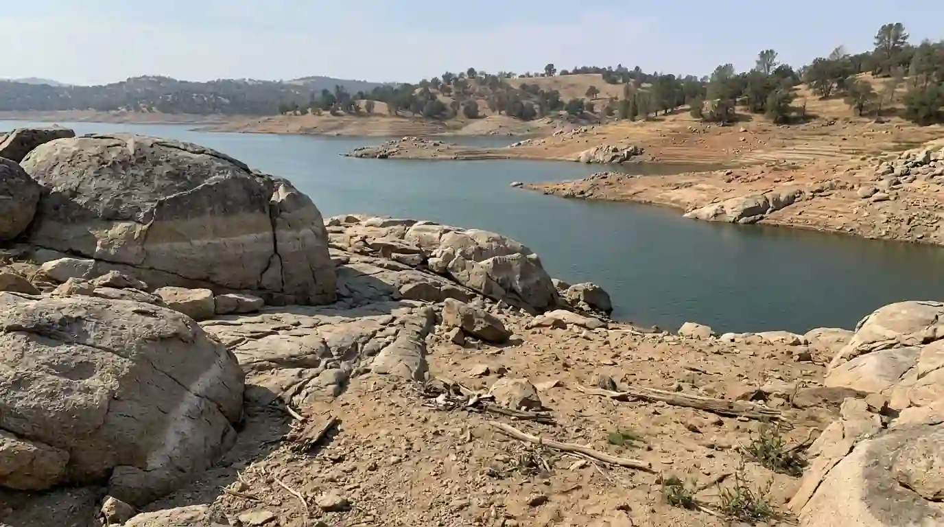 Folsom Lake shoreline with low water and granite boulders